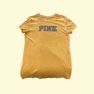 PINK, yellow tee shirt, size Large